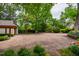 Paver driveway offers ample parking space amidst lush greenery at 220 Glandon Dr, Chapel Hill, NC 27514