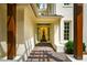 Exterior view of the front door with stone tiles and a sidelight at 220 Glandon Dr, Chapel Hill, NC 27514
