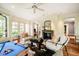 Spacious game room featuring a pool table, fireplace, and comfortable seating area at 220 Glandon Dr, Chapel Hill, NC 27514