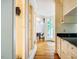 Hallway with built-in shelving and views towards the dining area at 220 Glandon Dr, Chapel Hill, NC 27514