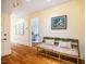 Hallway with bench, artwork, and hardwood floors at 220 Glandon Dr, Chapel Hill, NC 27514