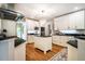 Bright kitchen with white cabinets, black countertops, and stainless steel appliances at 220 Glandon Dr, Chapel Hill, NC 27514