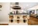 Gourmet kitchen with sleek countertops, shelving, and stainless steel range hood at 220 Glandon Dr, Chapel Hill, NC 27514