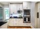 Stylish kitchen featuring stainless steel appliances, white cabinets, and dark countertops at 220 Glandon Dr, Chapel Hill, NC 27514