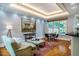 Inviting living room with large windows and tray ceiling, perfect for entertaining guests at 220 Glandon Dr, Chapel Hill, NC 27514