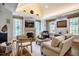 Bright living room features hardwood floors, fireplace and TV, and elegant decor at 220 Glandon Dr, Chapel Hill, NC 27514