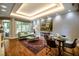 Sunlit living space with tray ceiling, artwork, and comfortable seating for relaxing and dining at 220 Glandon Dr, Chapel Hill, NC 27514