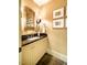 Classic powder room with vanity and decorative mirror at 220 Glandon Dr, Chapel Hill, NC 27514