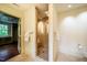 Bathroom featuring glass enclosed shower, large tile and natural lighting at 220 Glandon Dr, Chapel Hill, NC 27514