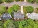 Aerial view of the home with mature trees and a well-maintained yard at 221 Mint Hill Dr, Cary, NC 27519