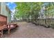 A partially fenced backyard with a wooden deck, great for relaxing outdoors at 221 Mint Hill Dr, Cary, NC 27519