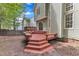 Multi-level deck in a large backyard with stairs leading to the lawn at 221 Mint Hill Dr, Cary, NC 27519