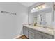 Bathroom featuring double sinks, modern lighting, and a large mirror at 221 Mint Hill Dr, Cary, NC 27519
