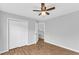 Cozy bedroom with closet and light-colored walls and wood-look flooring at 221 Mint Hill Dr, Cary, NC 27519