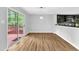 Bright dining area with sliding glass doors to deck, seamlessly connected to a modern kitchen at 221 Mint Hill Dr, Cary, NC 27519