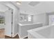 Well-lit hallway with white trim and wood-look floors, leading to other rooms at 221 Mint Hill Dr, Cary, NC 27519