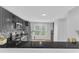 Modern kitchen with stainless steel appliances, stone backsplash, and a breakfast bar at 221 Mint Hill Dr, Cary, NC 27519