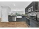 Updated kitchen with stainless steel appliances, modern cabinetry, and a granite countertop at 221 Mint Hill Dr, Cary, NC 27519