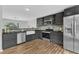 Gorgeous kitchen featuring stainless steel appliances, stone backsplash, and an eat-in area at 221 Mint Hill Dr, Cary, NC 27519