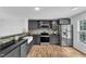 Stylish kitchen with stainless steel appliances, granite countertops, and plenty of storage space at 221 Mint Hill Dr, Cary, NC 27519