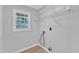 A laundry room with modern hardwood floors and hookups at 221 Mint Hill Dr, Cary, NC 27519