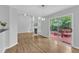 Bright living room features a fireplace, hardwood floors, and a sliding glass door to the deck at 221 Mint Hill Dr, Cary, NC 27519