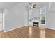 Spacious living room with vaulted ceilings, fireplace, and large windows offering abundant natural light at 221 Mint Hill Dr, Cary, NC 27519