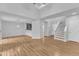 Open-concept living space with high ceilings, hardwood floors, and seamless transitions to kitchen and entry at 221 Mint Hill Dr, Cary, NC 27519