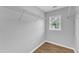 A large walk-in closet offers lots of space and has hardwood floors at 221 Mint Hill Dr, Cary, NC 27519