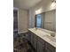 Bathroom featuring double sinks, a large mirror, and tile flooring at 244 Kipling Crk Dr, Fuquay Varina, NC 27526