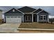 Charming single-Gathering home with a two-car garage, stone accents, and professionally landscaped yard at 244 Kipling Crk Dr, Fuquay Varina, NC 27526