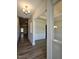 Spacious foyer featuring hardwood floors, modern lighting, and elegant trim work throughout at 244 Kipling Crk Dr, Fuquay Varina, NC 27526