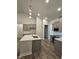 Spacious kitchen with gray cabinets, white countertops, and stainless steel appliances at 244 Kipling Crk Dr, Fuquay Varina, NC 27526
