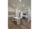 Modern kitchen with gray cabinets, stainless steel appliances, and a large center island at 244 Kipling Crk Dr, Fuquay Varina, NC 27526