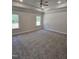 Bright main bedroom featuring a ceiling fan and two windows offering ample natural light at 244 Kipling Crk Dr, Fuquay Varina, NC 27526