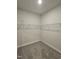 Empty walk-in closet offering ample storage space with wire shelving at 244 Kipling Crk Dr, Fuquay Varina, NC 27526