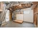 Exposed basement featuring unfinished walls, ceiling and containing a water heater and utility connections at 2616 Wedgedale Ave, Durham, NC 27703