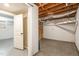 Unfinished basement area showcasing exposed rafters and duct work at 2616 Wedgedale Ave, Durham, NC 27703