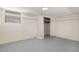 Unfinished basement area showcasing painted cinder block walls and an unfinished closet area at 2616 Wedgedale Ave, Durham, NC 27703