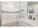 Bathroom featuring stylish white subway tile and sleek, modern fixtures at 2616 Wedgedale Ave, Durham, NC 27703