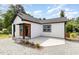 Charming cottage-style home featuring a new patio, gravel landscaping, and contrasting trim at 2616 Wedgedale Ave, Durham, NC 27703