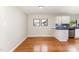 Open-concept kitchen and dining area with hardwood floors and modern finishes at 2616 Wedgedale Ave, Durham, NC 27703