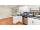 Well-lit kitchen featuring stainless steel appliances, granite countertops and stylish backsplash at 2616 Wedgedale Ave, Durham, NC 27703