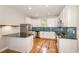 Bright kitchen with white cabinets, granite countertops and stainless appliances at 2616 Wedgedale Ave, Durham, NC 27703