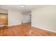 Spacious living area featuring hardwood floors, neutral walls, and ample natural light at 2616 Wedgedale Ave, Durham, NC 27703