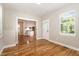 Open living space with beautiful wood floors that leads into kitchen at 2616 Wedgedale Ave, Durham, NC 27703