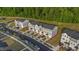 Aerial view of townhomes featuring neutral exteriors, attached garages, and well maintained landscaping at 2617 Chert Ln, Raleigh, NC 27610