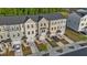 Aerial view of townhomes featuring neutral exteriors, attached garages, and well maintained landscaping at 2617 Chert Ln, Raleigh, NC 27610