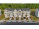Aerial view of townhomes in a planned community featuring garages and well-kept landscaping at 2617 Chert Ln, Raleigh, NC 27610