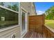 Private balcony featuring wood floors and a wood privacy screen near the door at 2617 Chert Ln, Raleigh, NC 27610